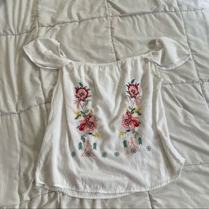 Embroidered white blouse.